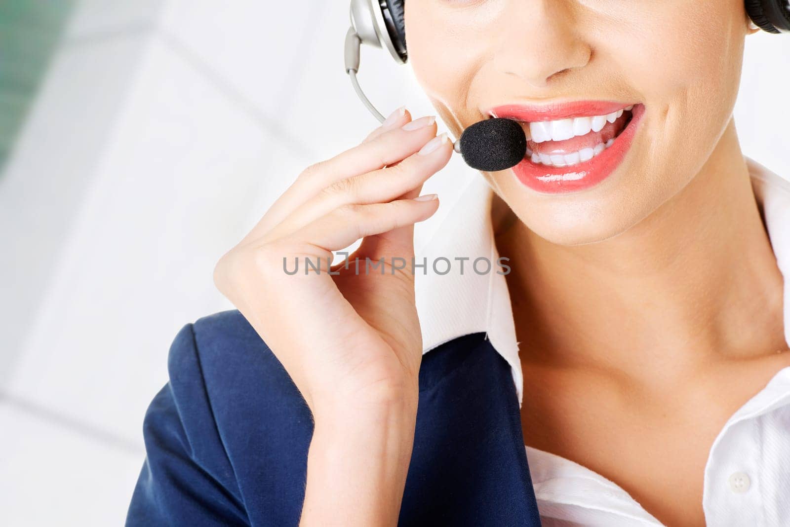 pretty call-center assistant smiling at the camera