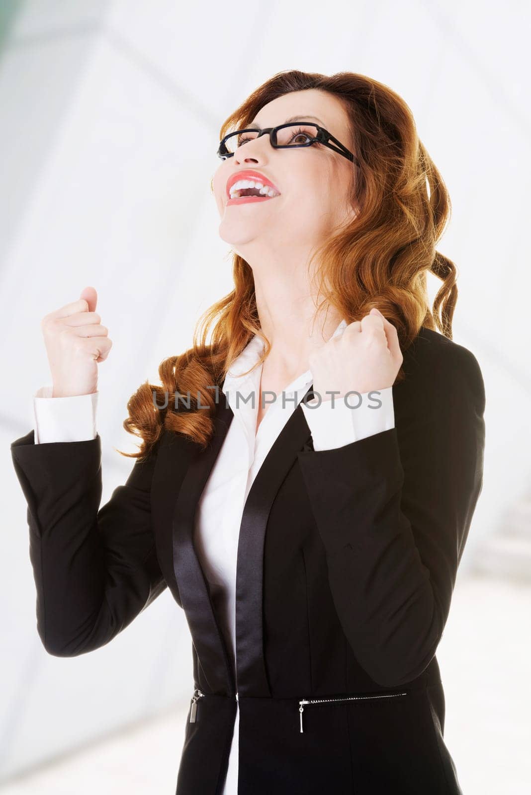 success,winner businesswoman with fists up
