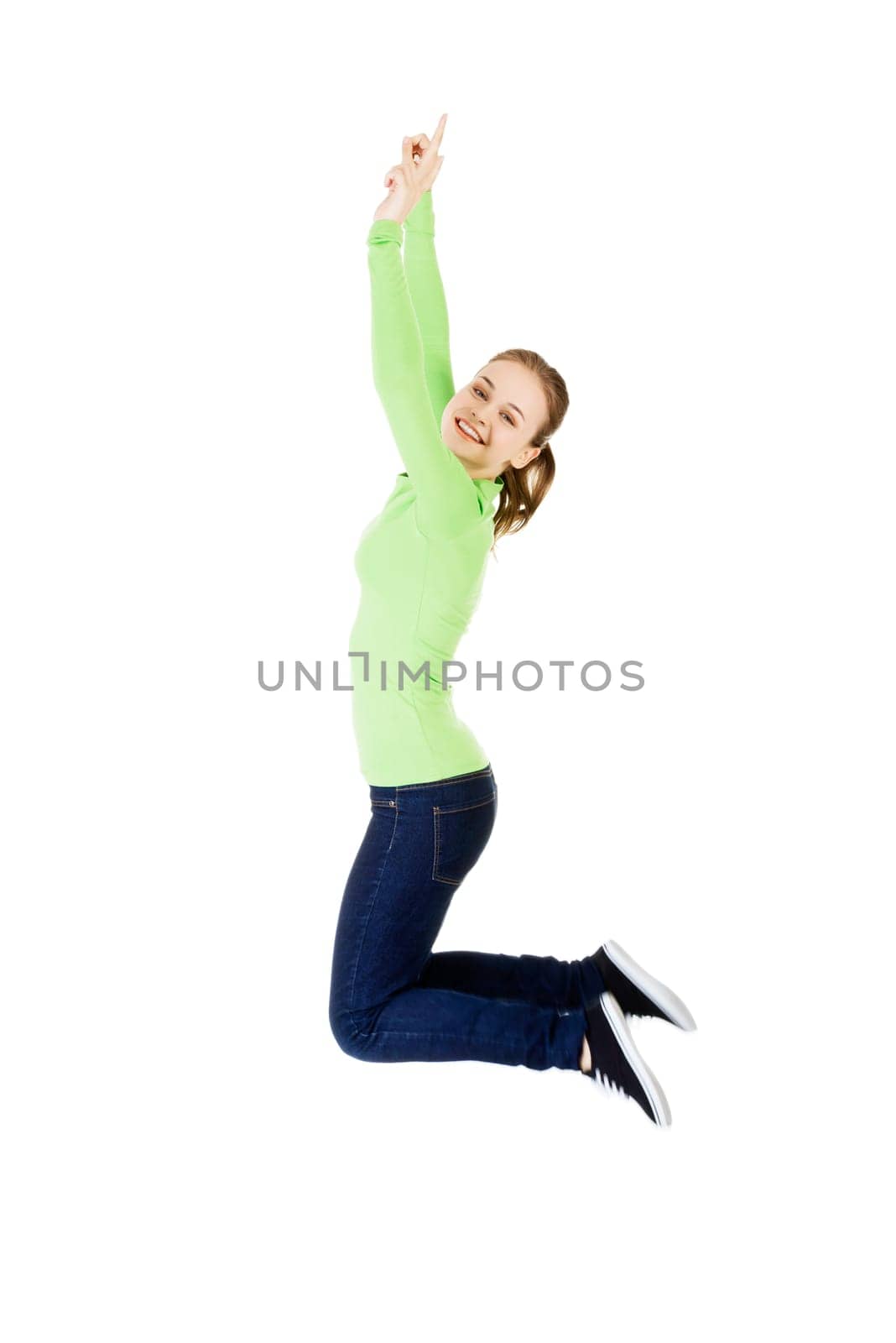 young happy caucasian woman jumping in the air,isolated on white background