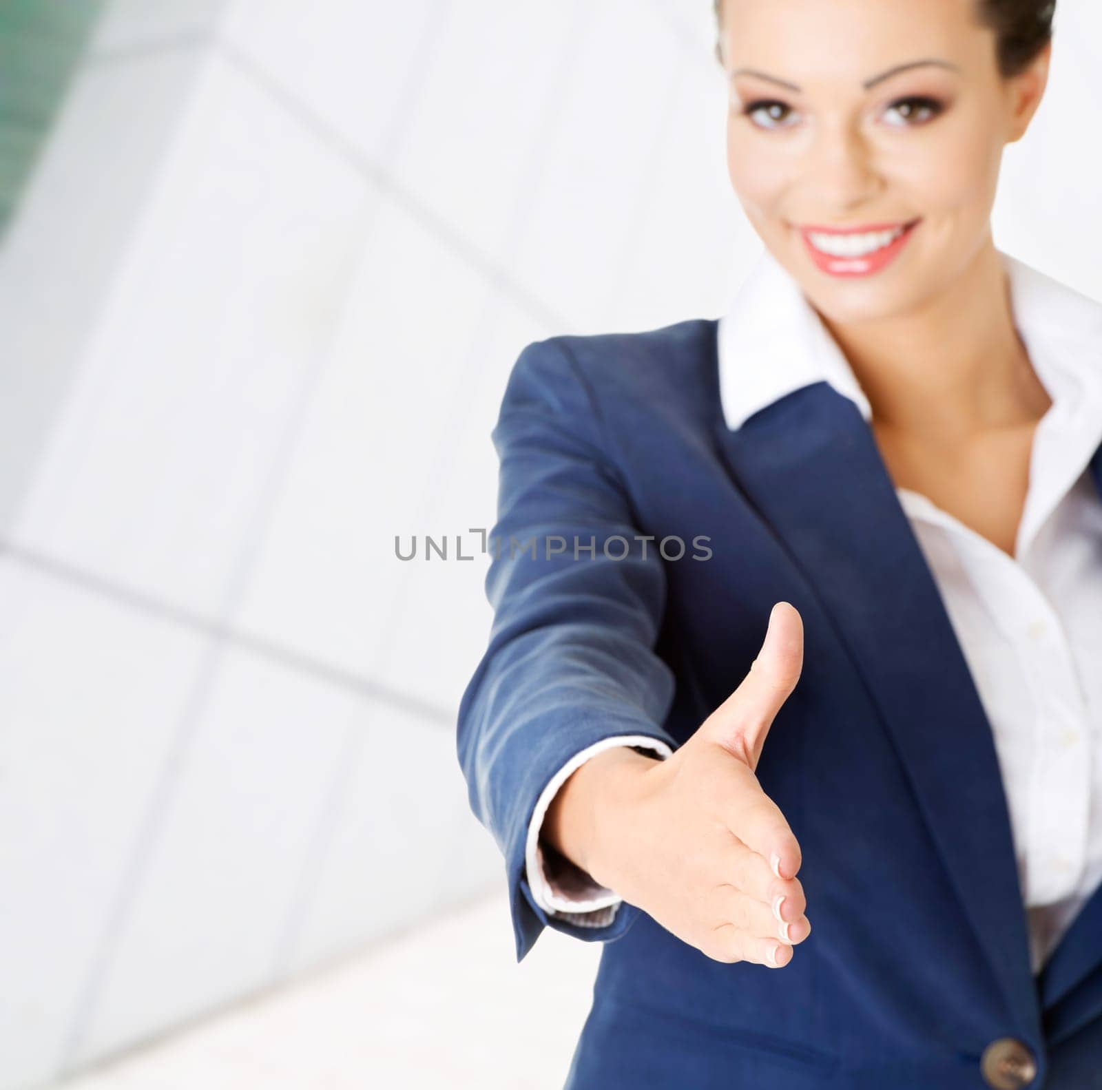 a beautiful businesswoman about to shake hands.