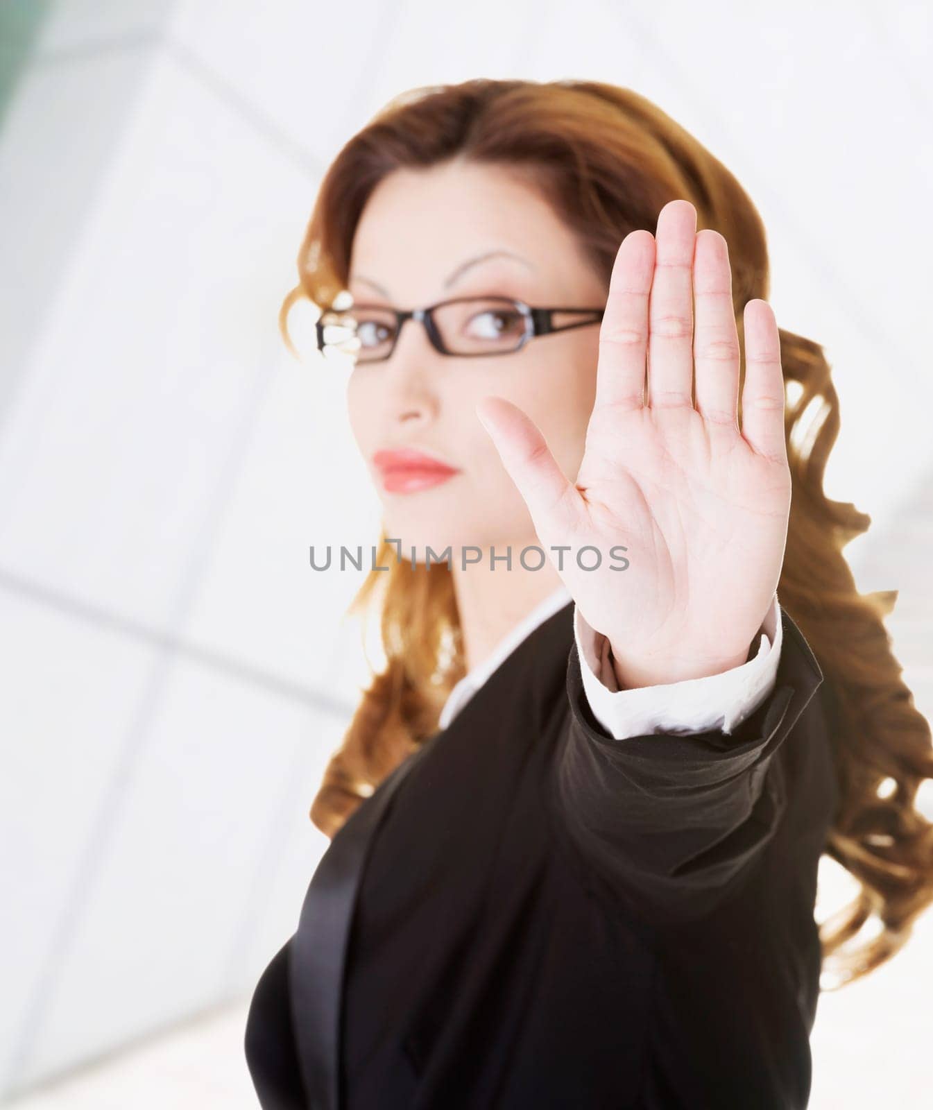 serious business woman gesturing stop sign