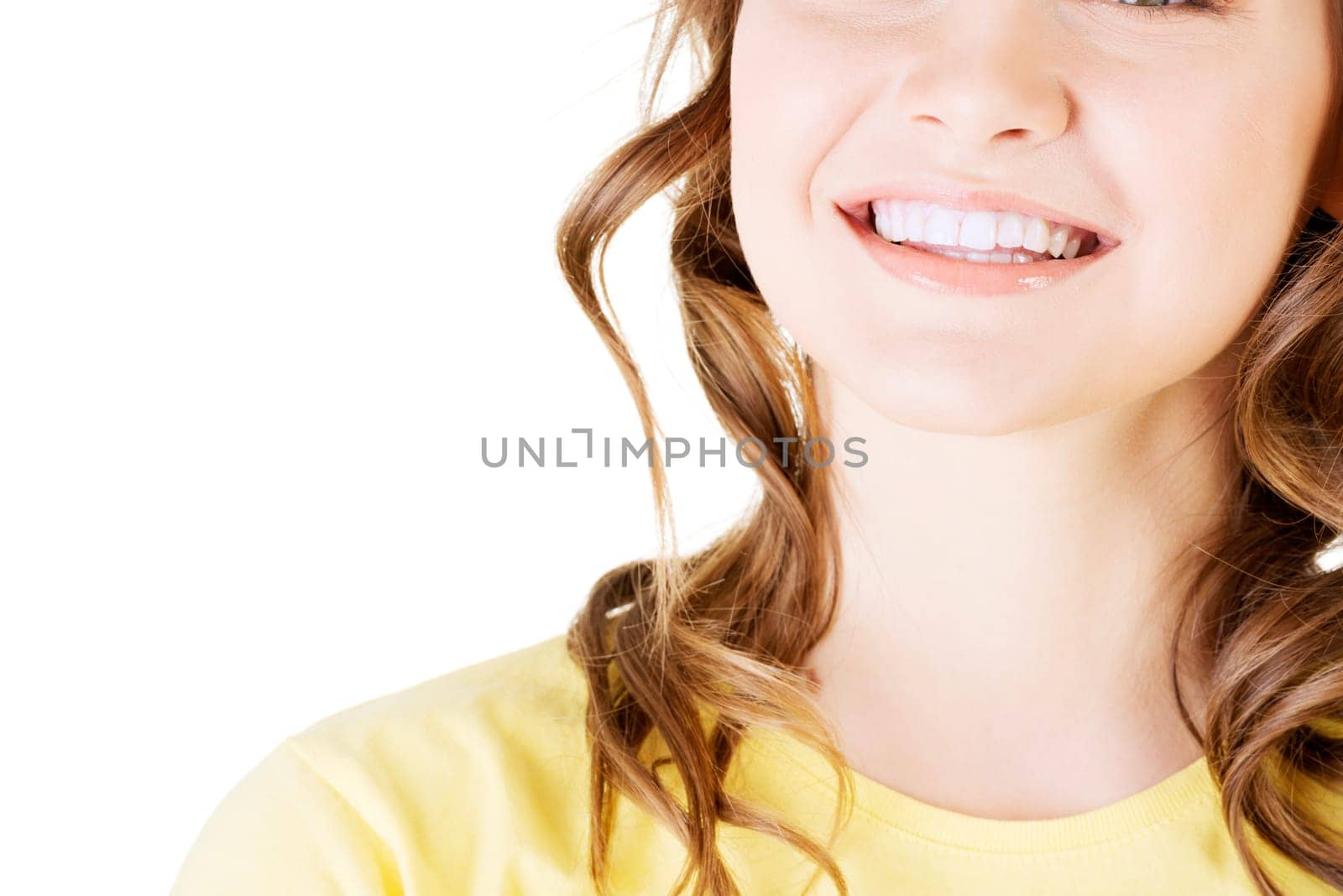 Beautiful woman with her perfect straight white teeth. Isolated.