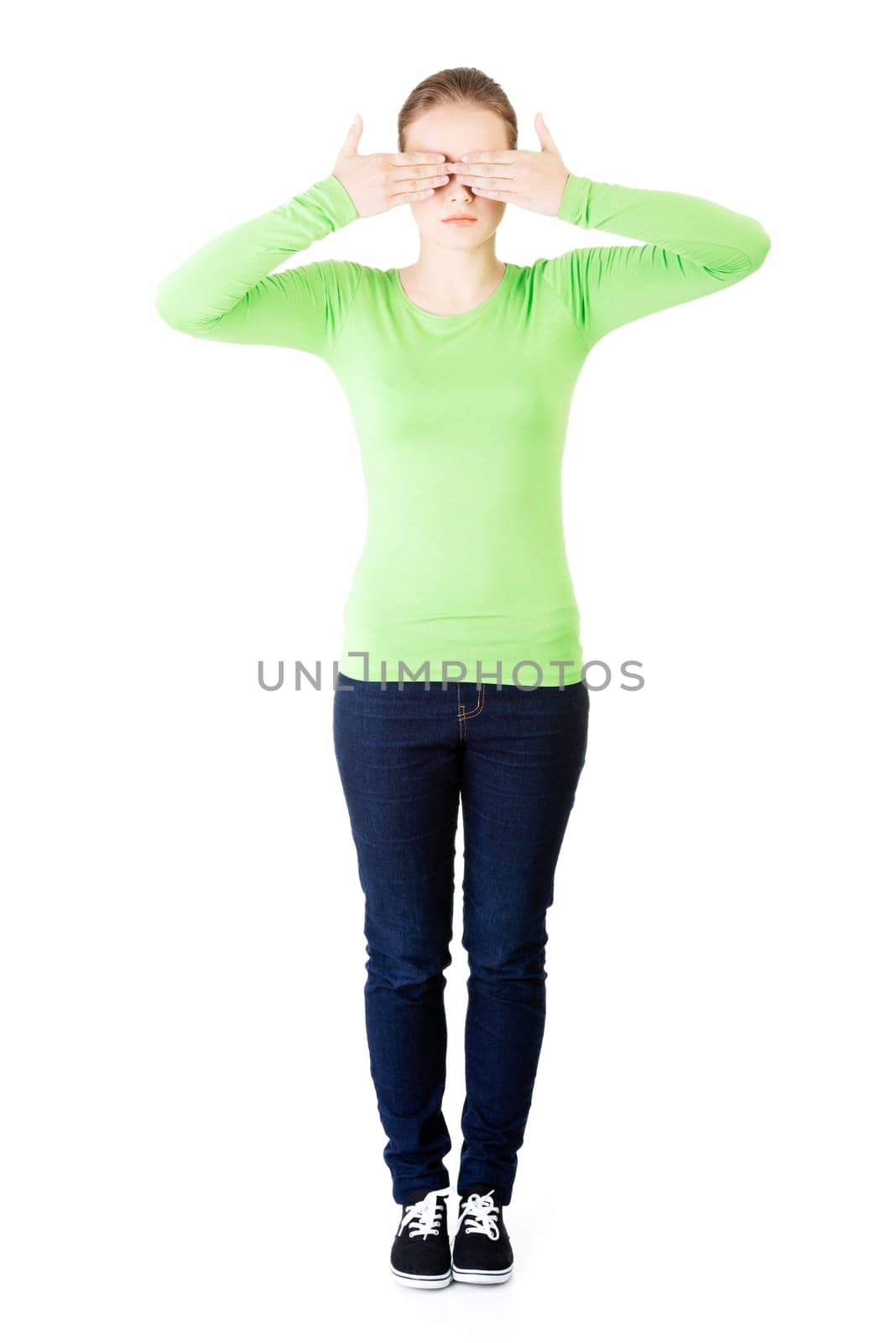 young teen woman covering her face,isolated on white