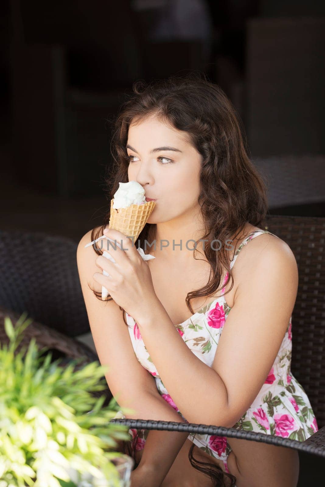 portrait of young woman eating ice-cream,outdoor