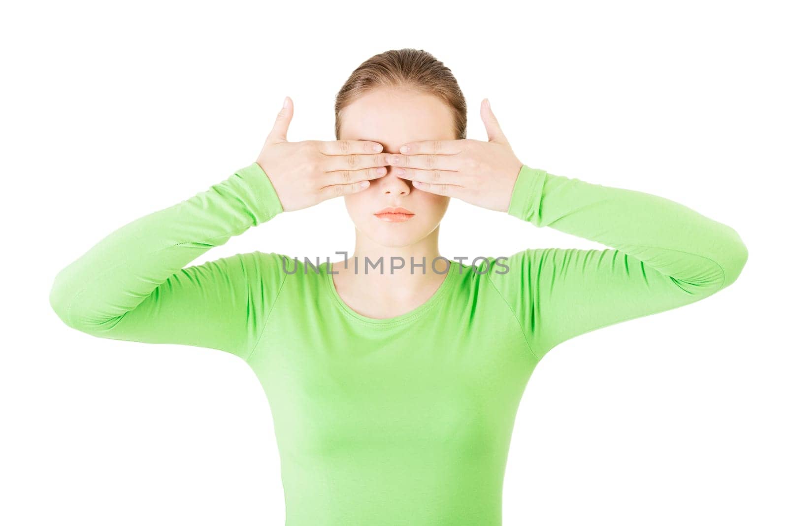 young teen woman covering her face with hands,isolated on white