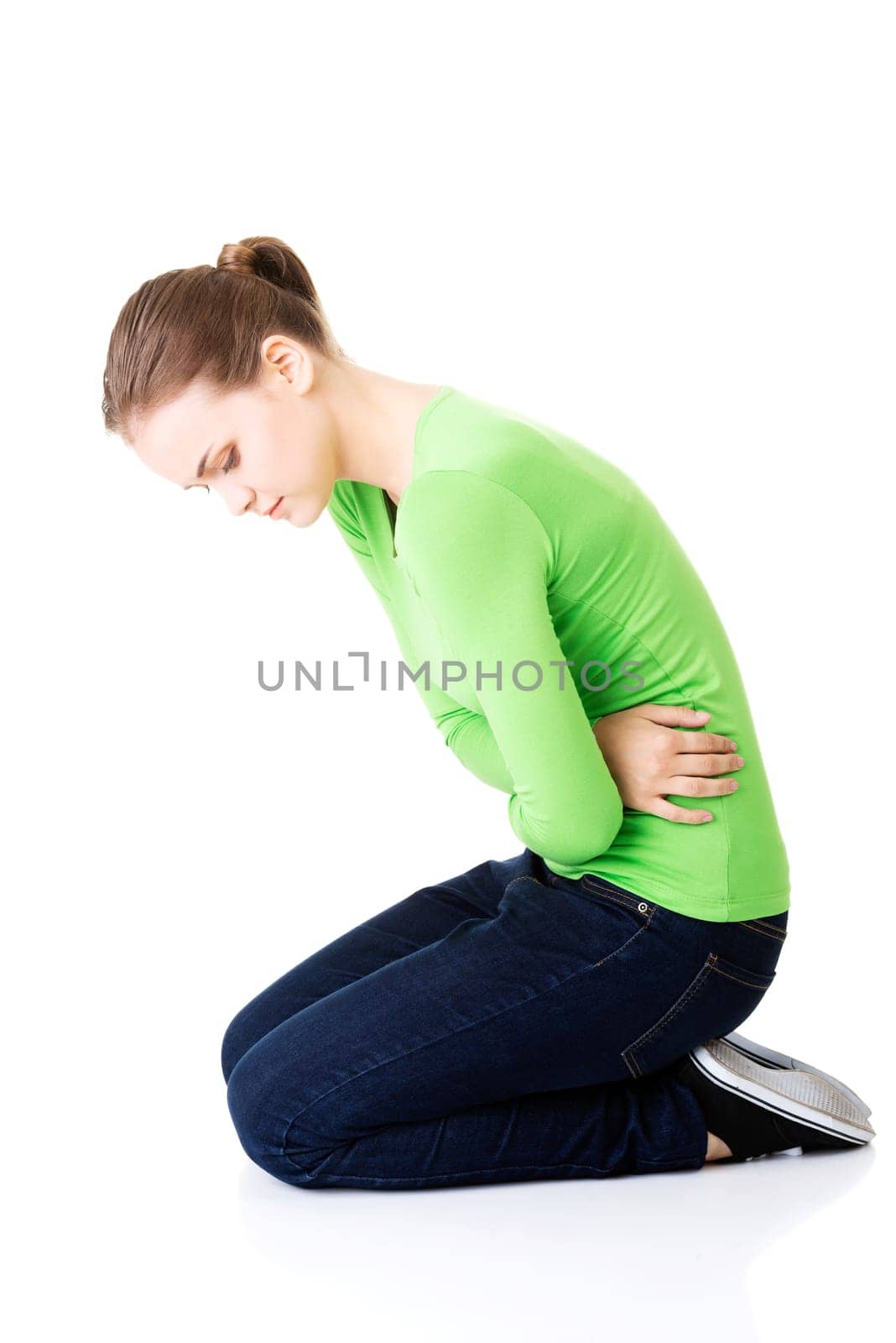 young woman with stomach issues,isolated on white