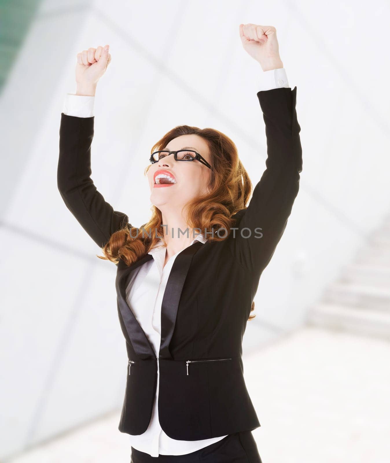success,winner businesswoman with fists up