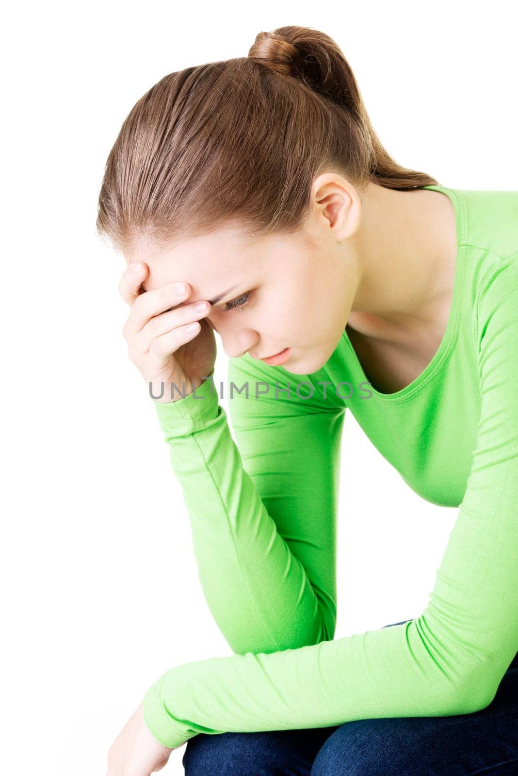 young beautiful woman in depression. isolated on white background.