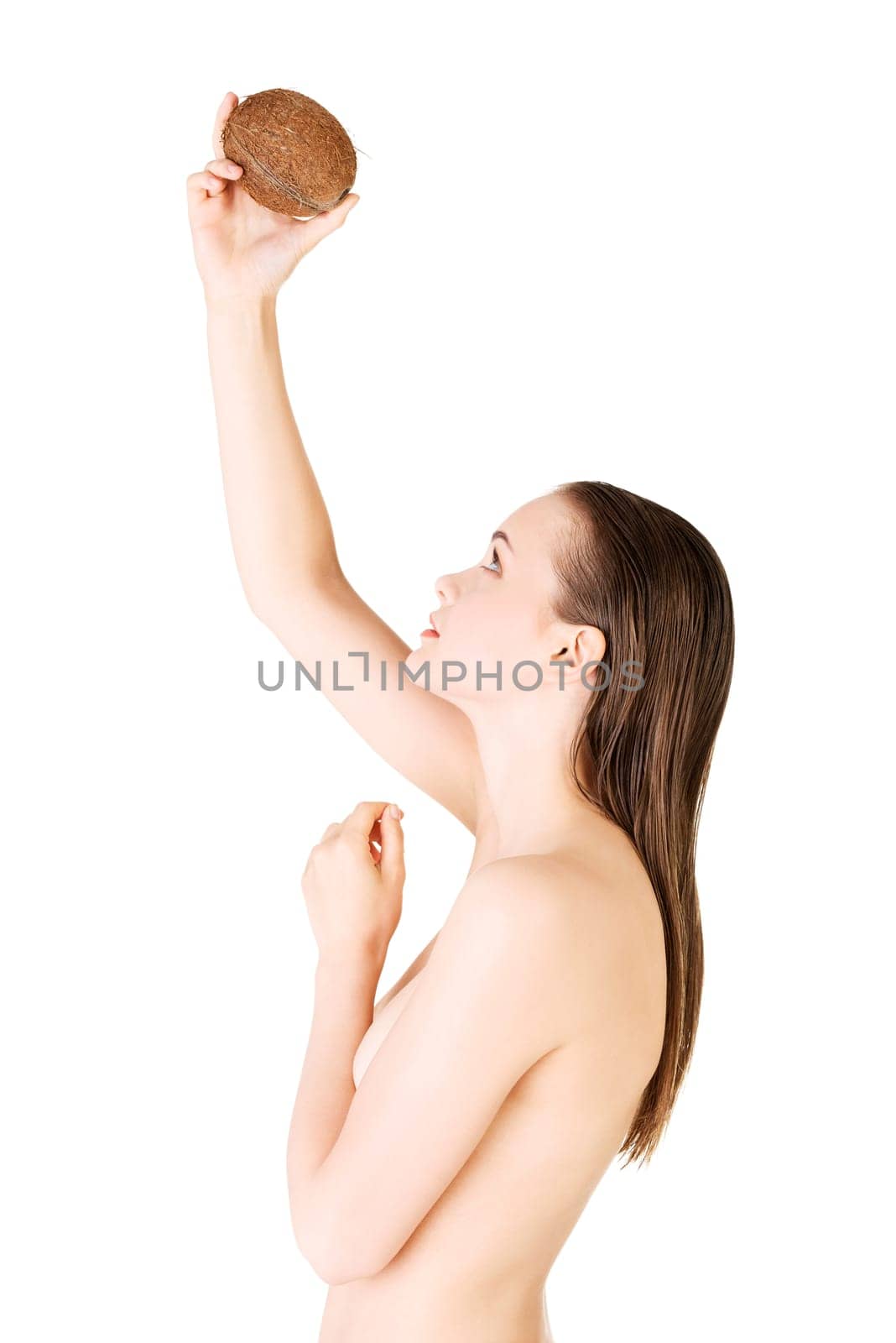 beautiful woman with coconut in hands over white background