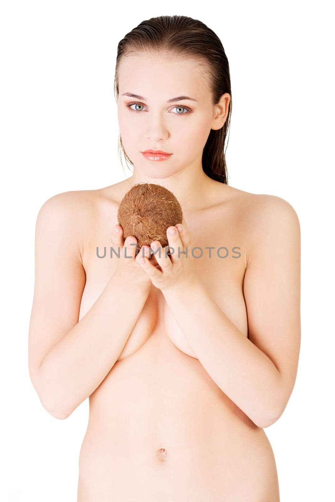 beautiful woman with coconut in hands over white background