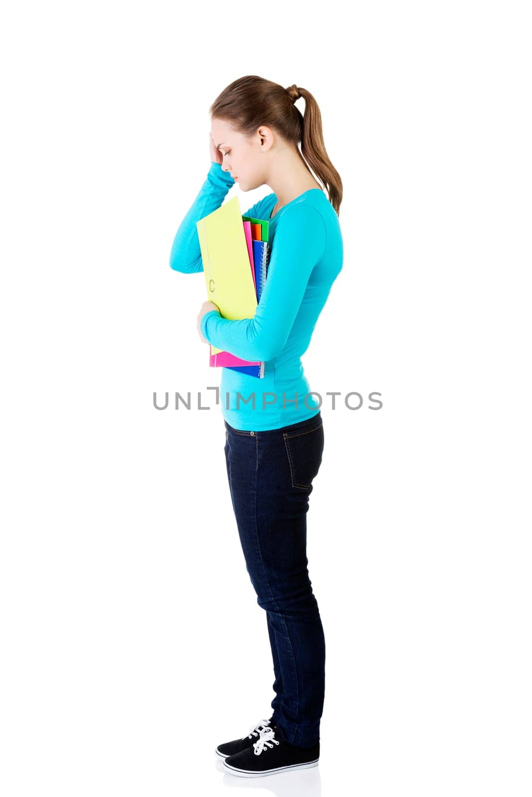 young beautiful student woman with depression or a problem isolated on white