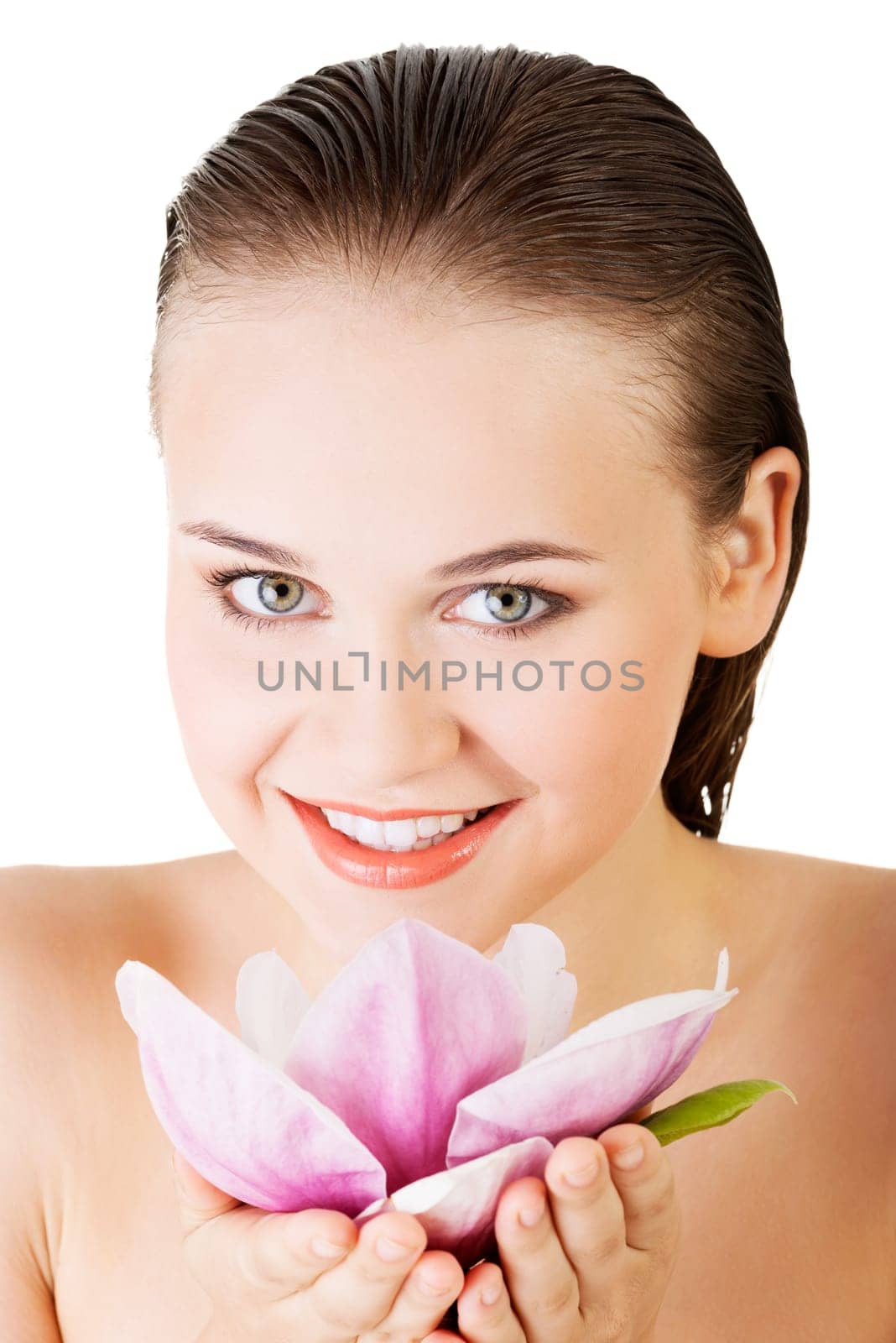 Beauty face of the young beautiful woman with flower. Girl on white background