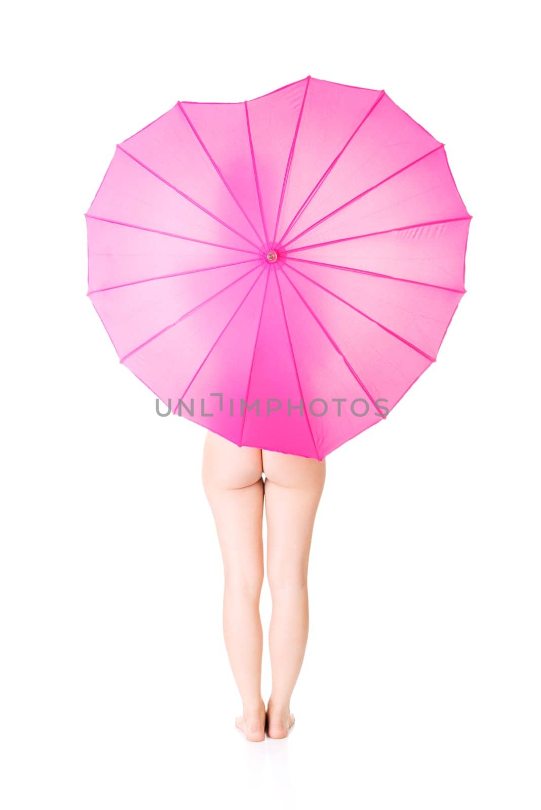 artistic shoot of beautiful nude woman under pink umbrella. isolated on white. feminism and woman health care concept.
