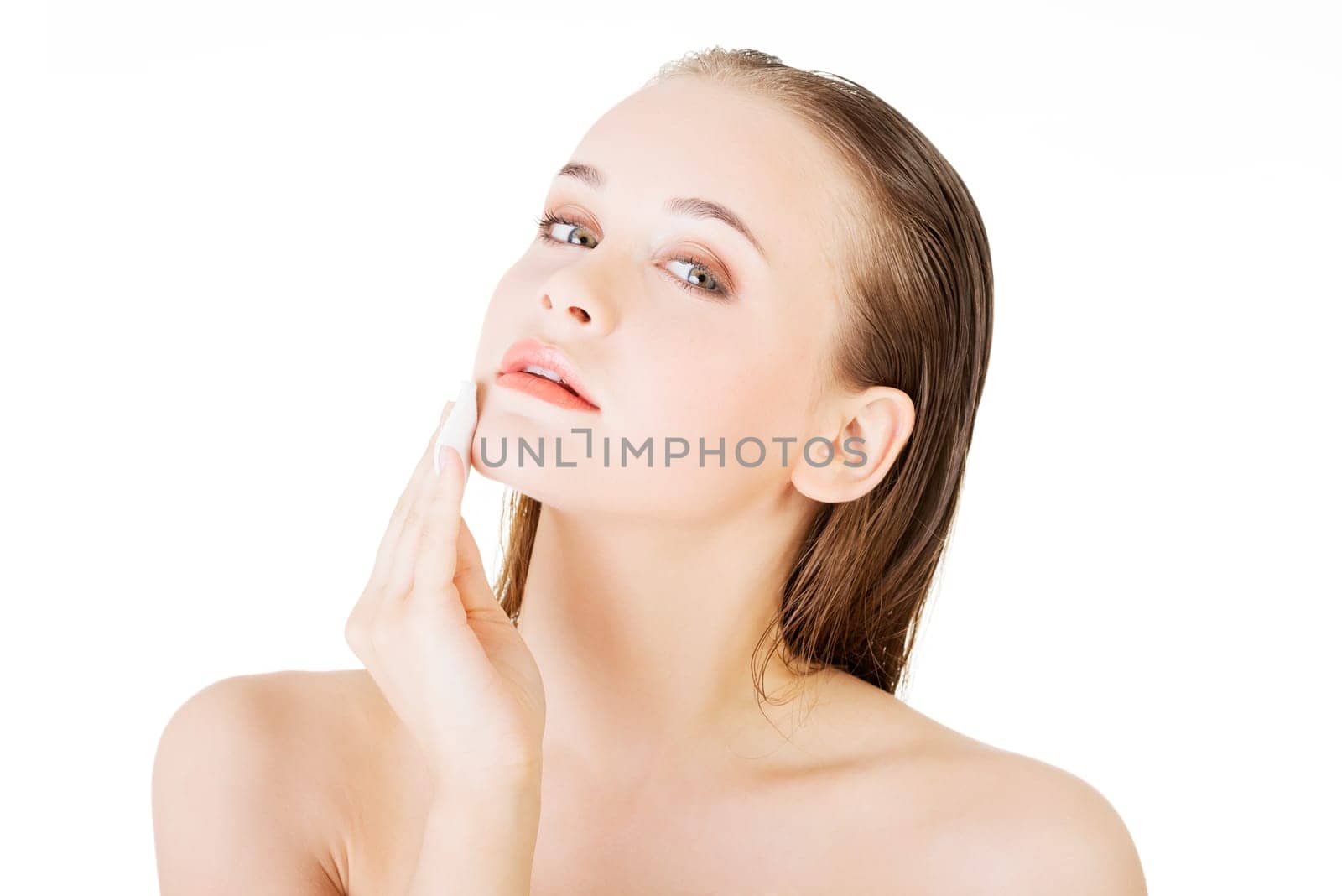 beautiful woman using cotton pad isolated on white
