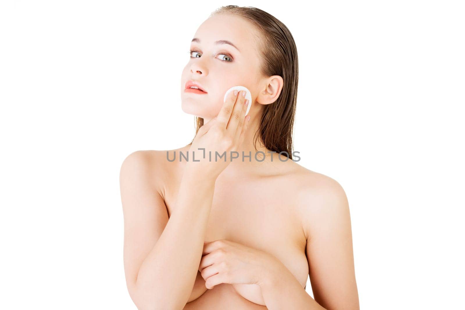 Beautiful woman using cotton pad ,isolated on white
