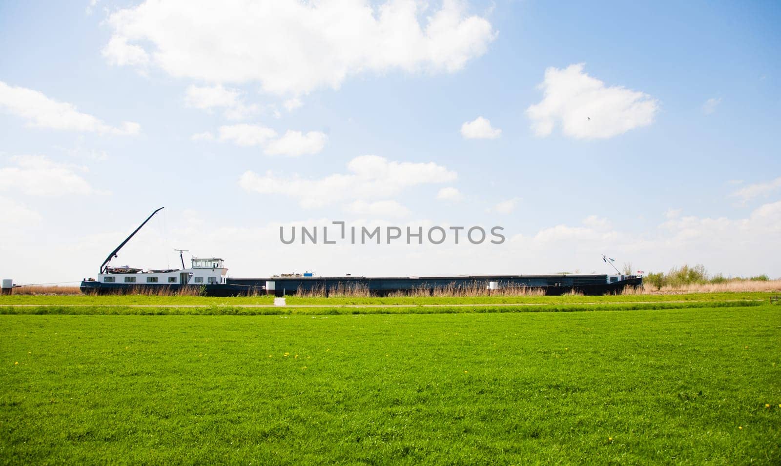 Inland navigation on a canal near Nijkerk in the Netherlands.