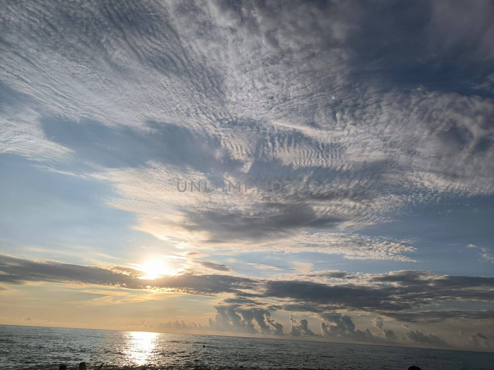 Sea water sunset sky landscape background blue nature orange light wallpaper evening travel white clouds . High quality photo
