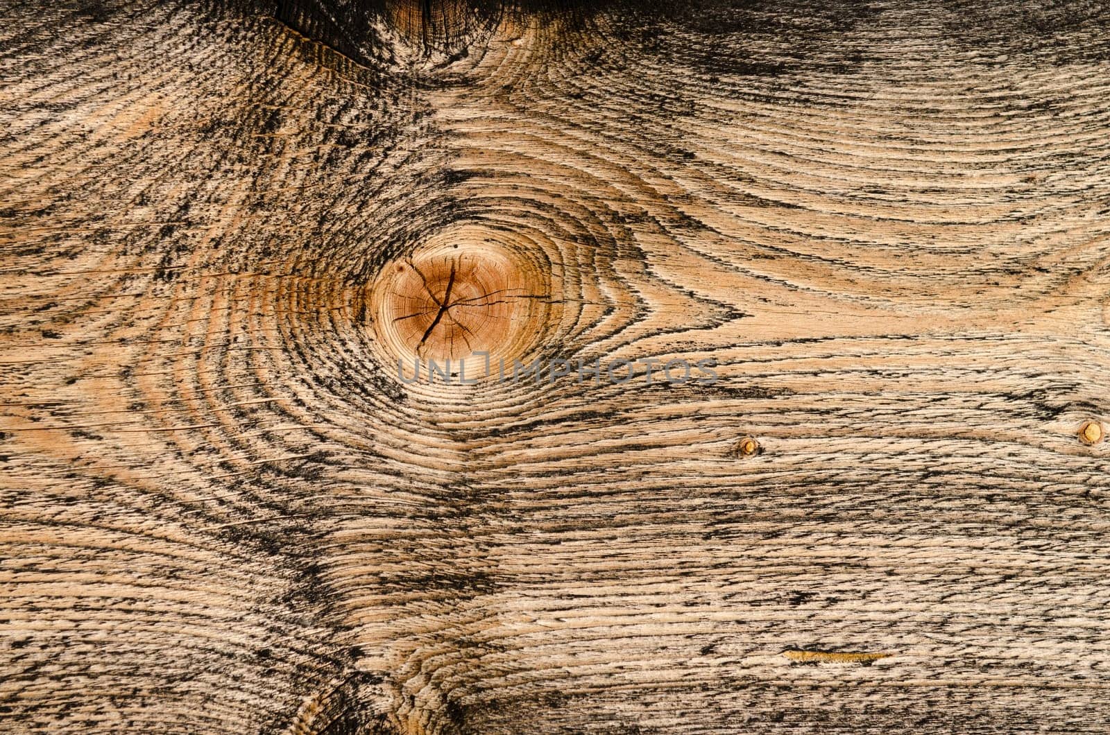 Close-up brown wooden board with cracked branch