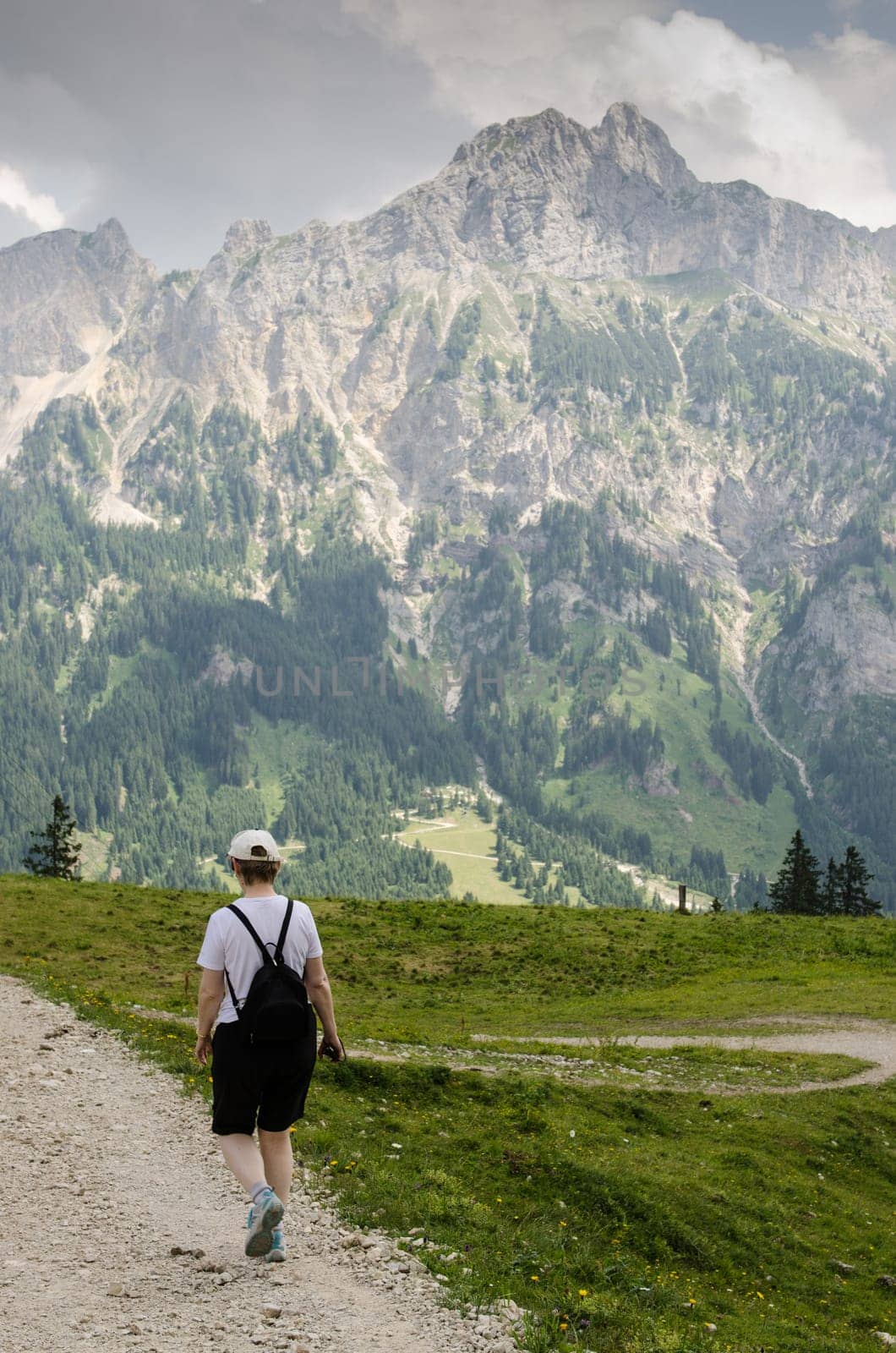 Woman on a trail hiking in the mountains