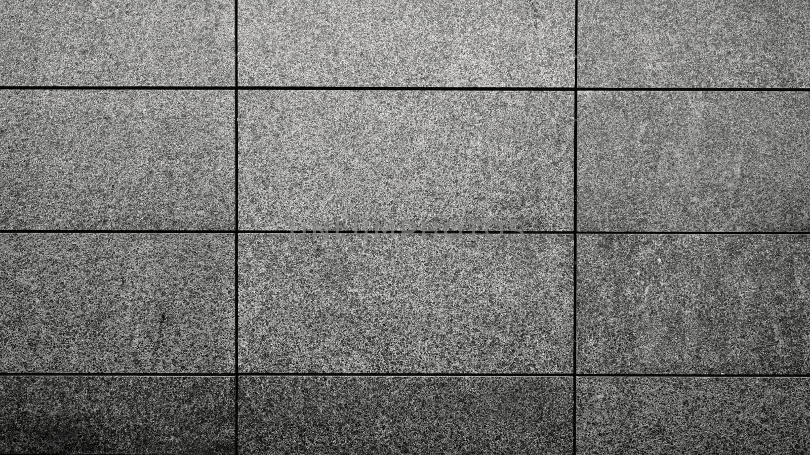Details of an outdoors wall made with slabs of beton in the city.