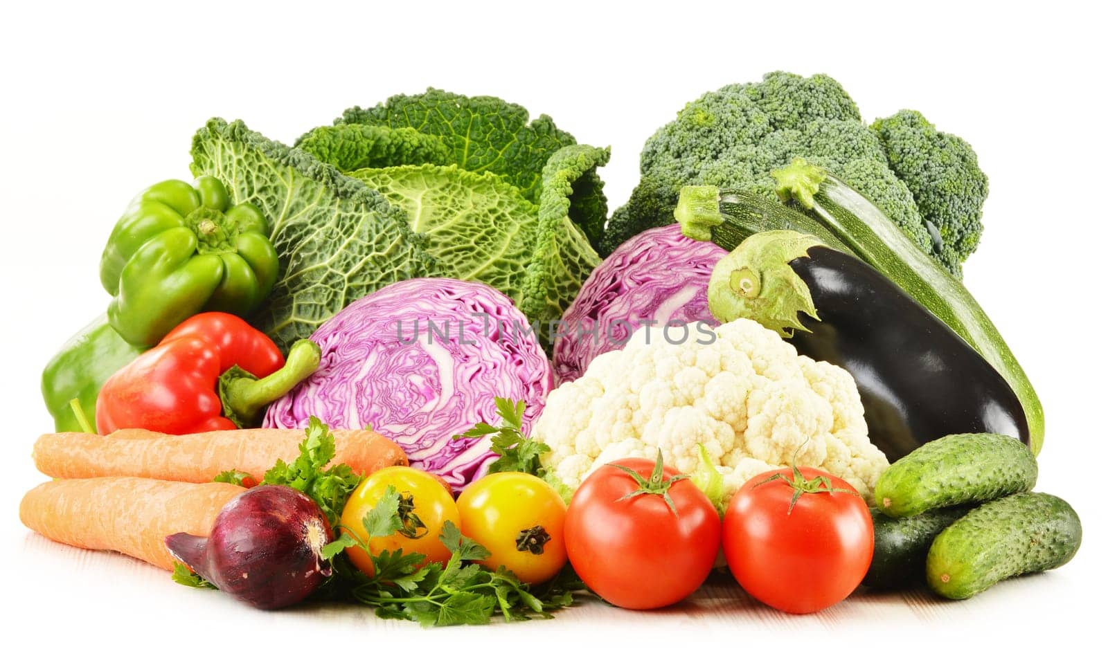 Composition with variety of fresh organic vegetables isolated on white