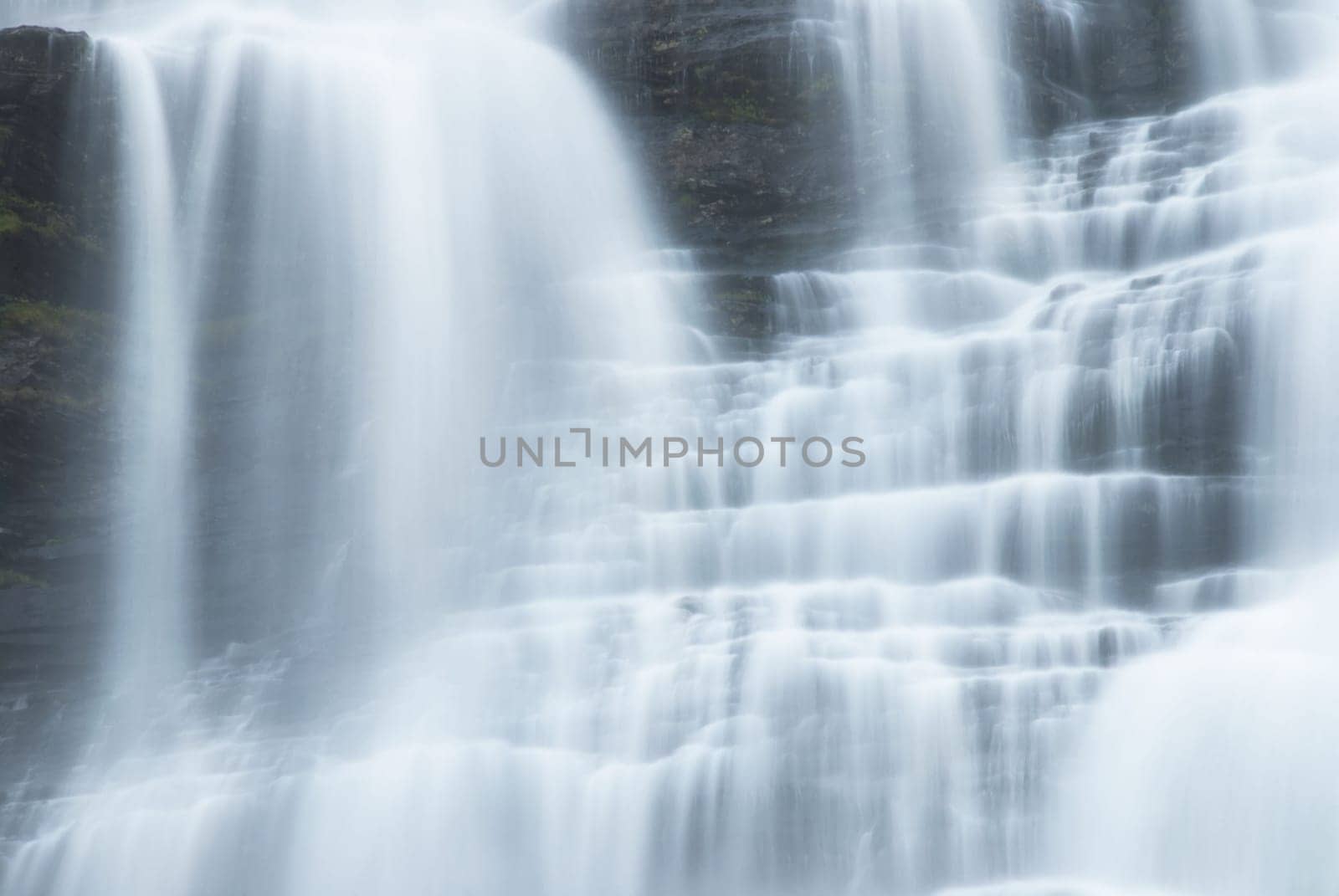 white water cascades running down stones