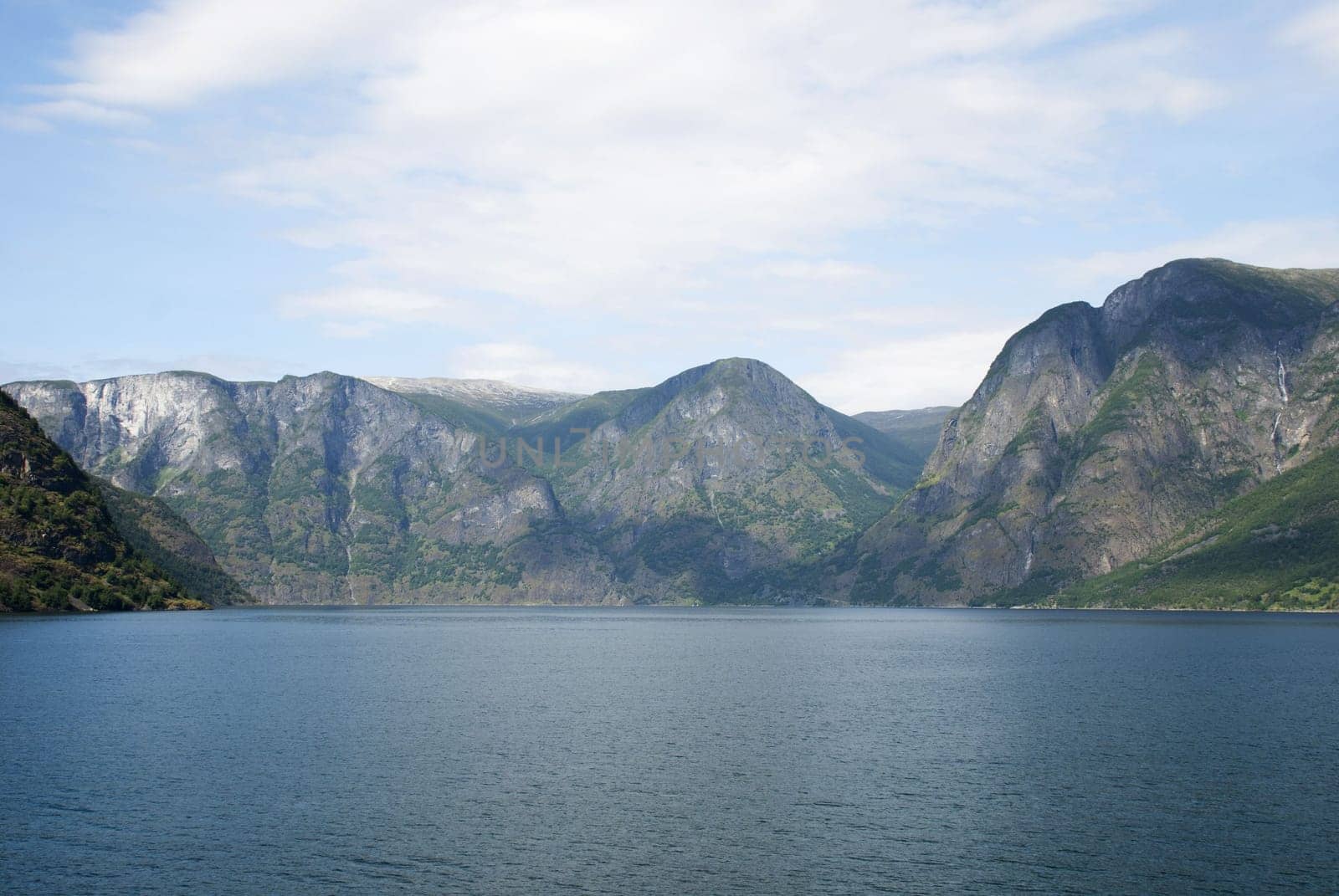a landscape of mountains and water in a norwegian fjord