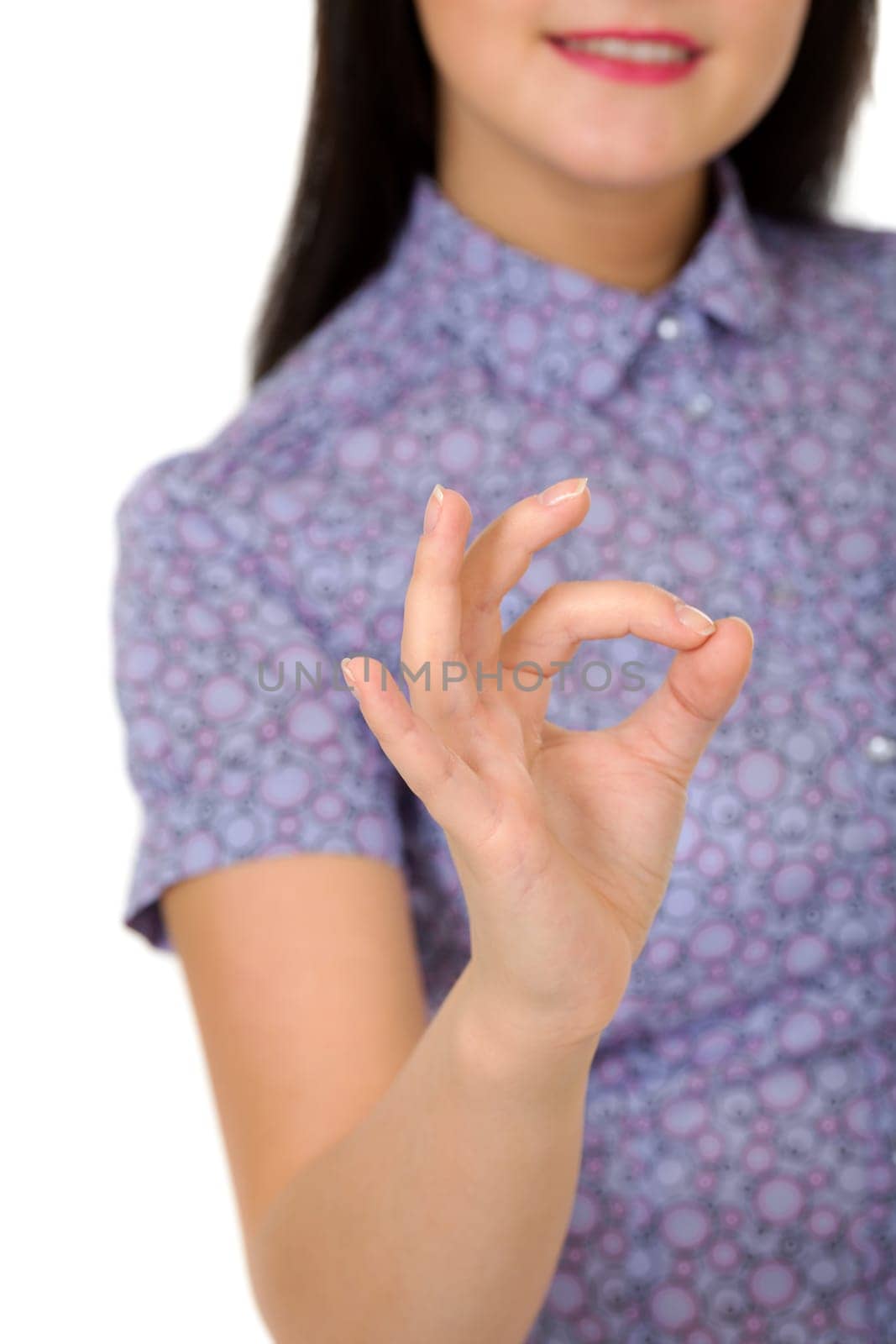 smiling girl showing OK sign isolated on white background