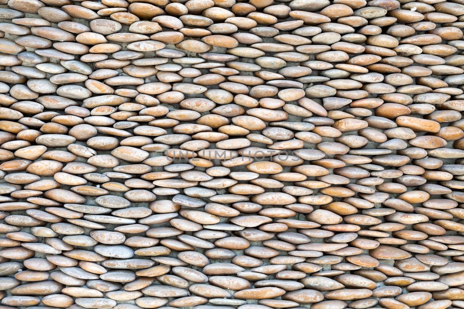 stone wall, lined with small pebbles