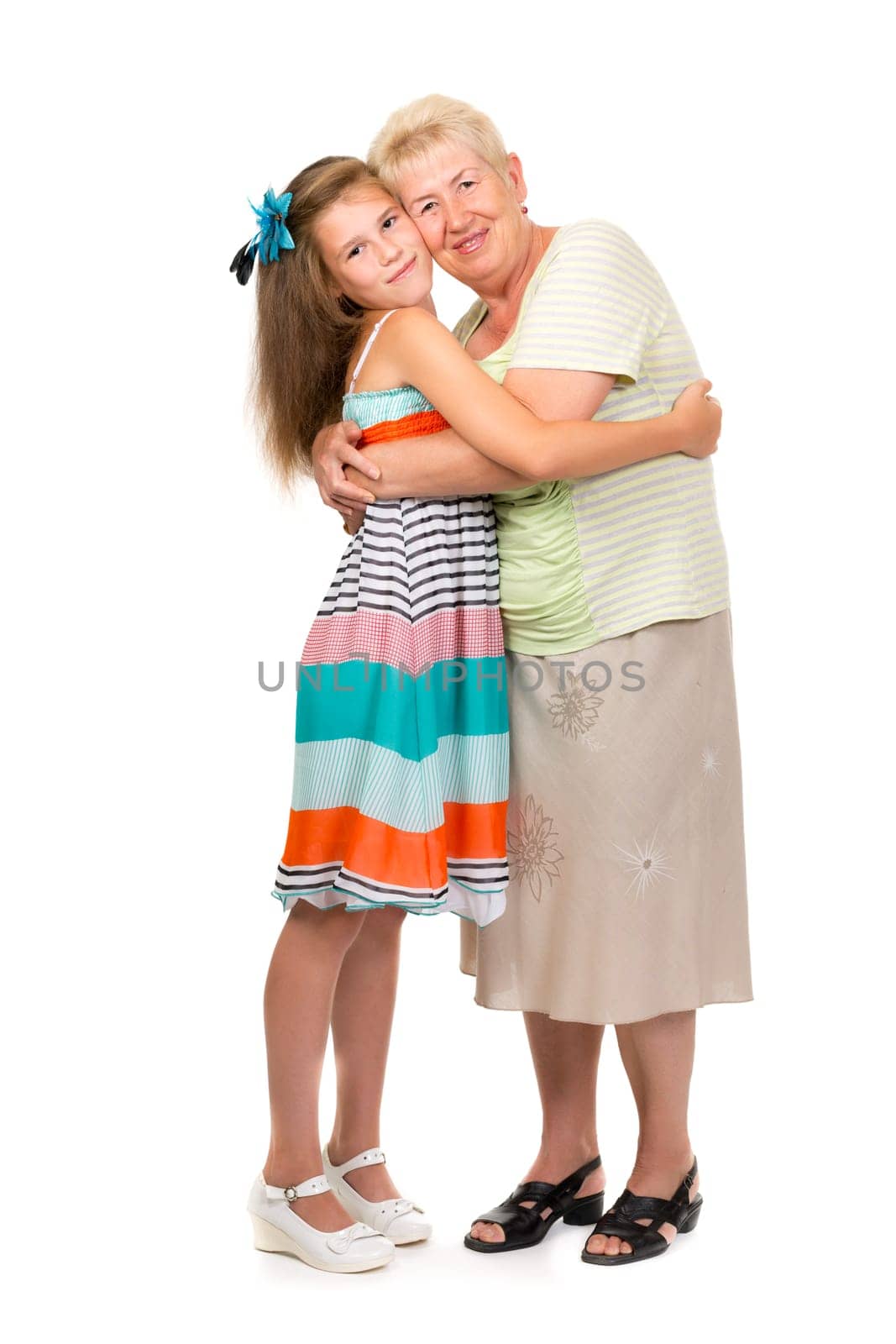 Grandmother with her granddaughter in the studio on a white isolate.