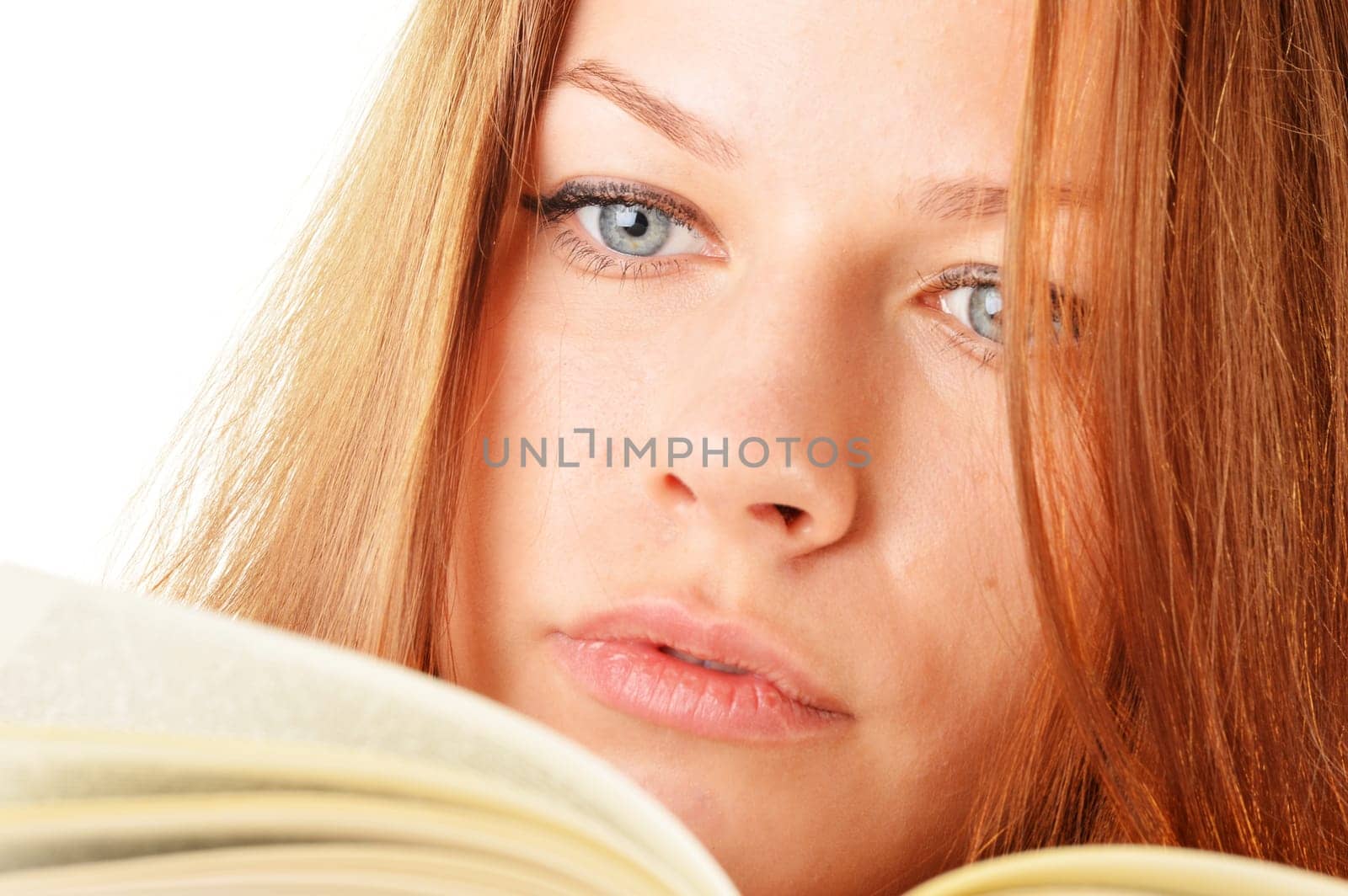 Young woman reading a book. Female student learning