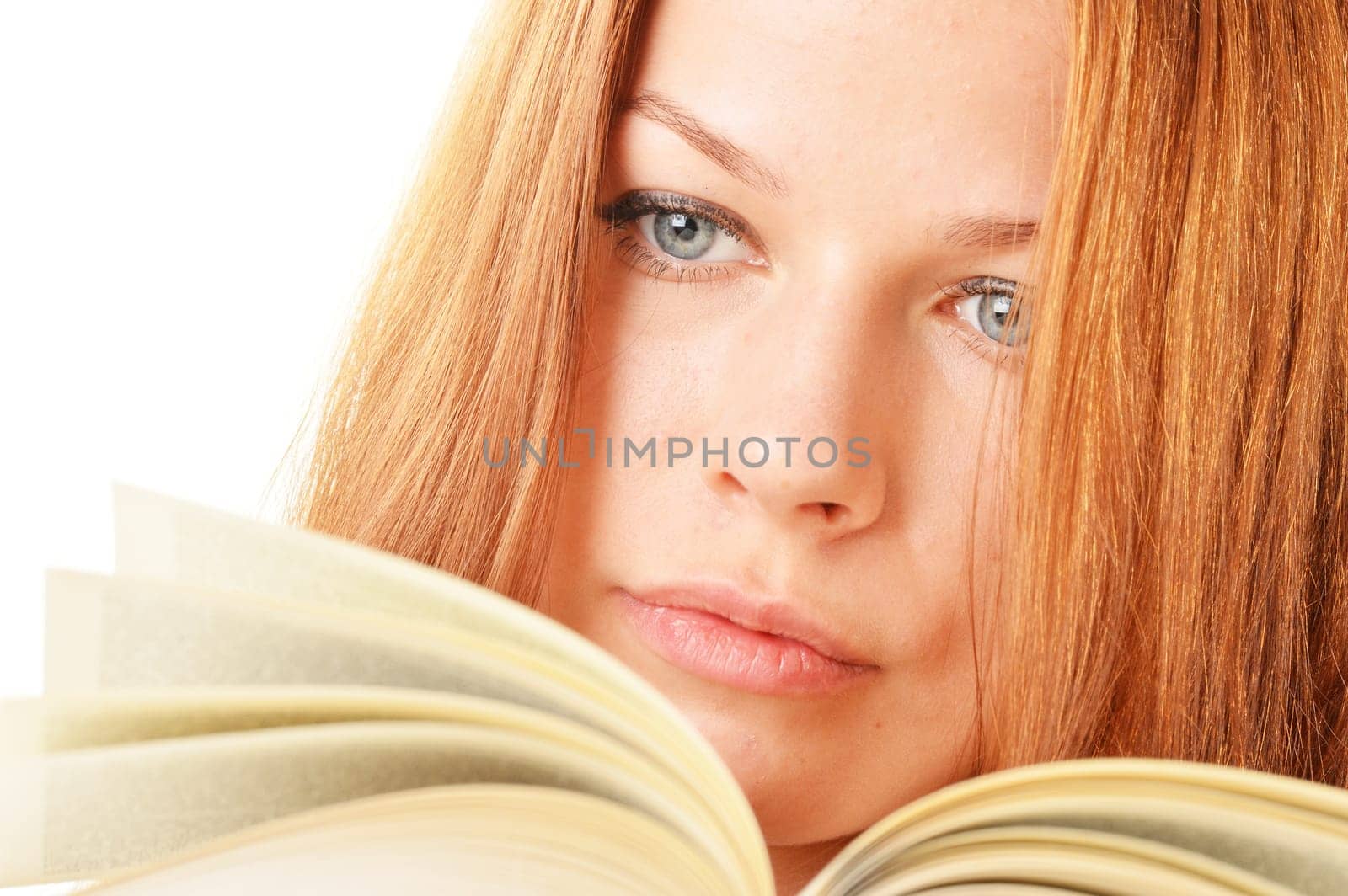 Young woman reading a book. Female student learning