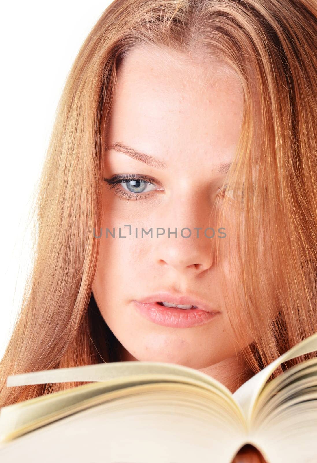 Young woman reading a book. Female student learning