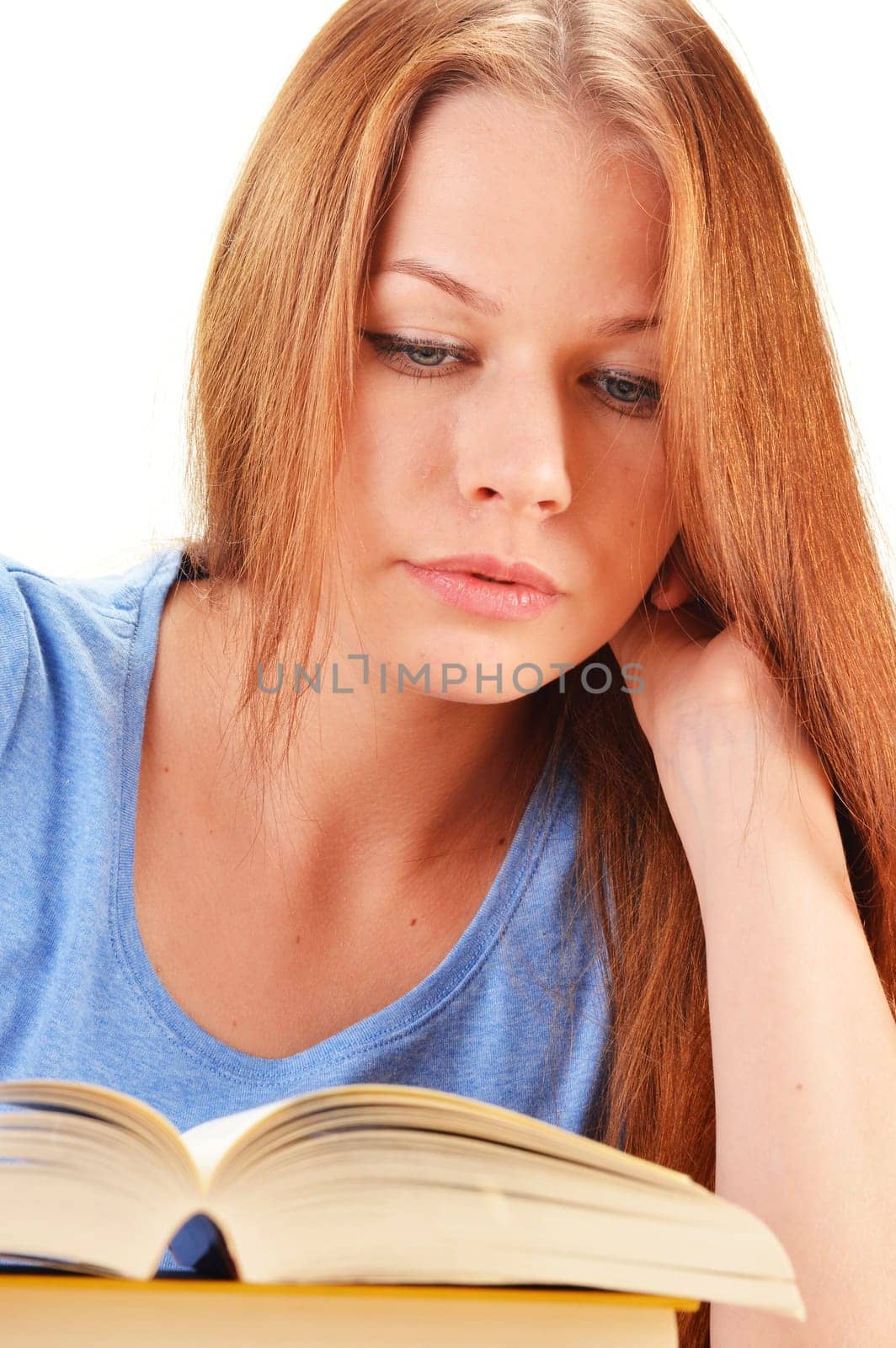 Young woman reading a book. Female student learning