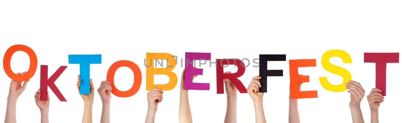 Many Hands Holding the German Word Oktoberfest Which is the Name of a Huge Festival