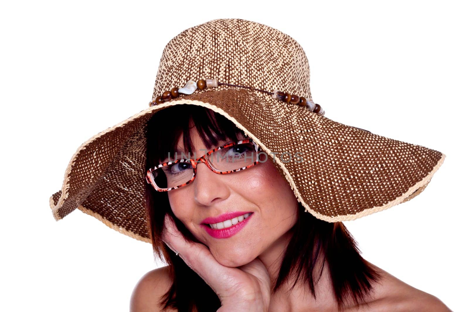A beautiful woman wearing a hat and sunglasses.