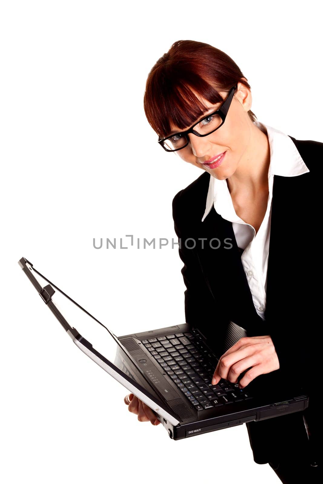 A portrait of a young confident business woman wearing a black business suit.
