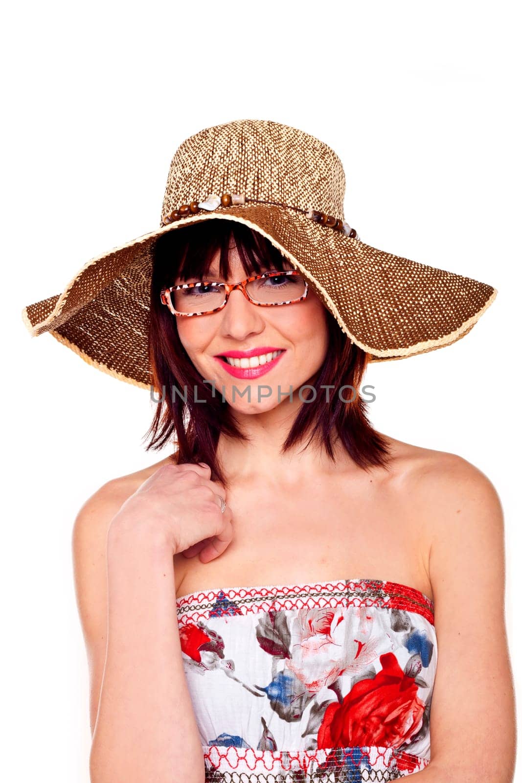 A beautiful woman wearing a hat and sunglasses.