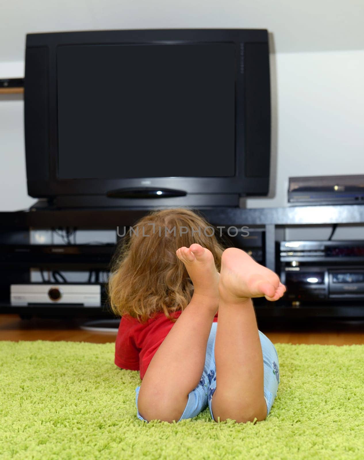 child is watching TV