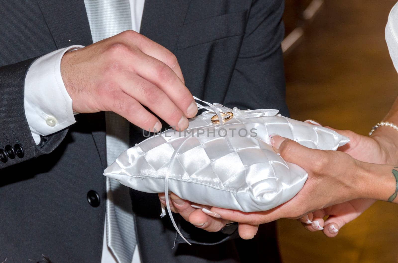 groom as they exchange rings