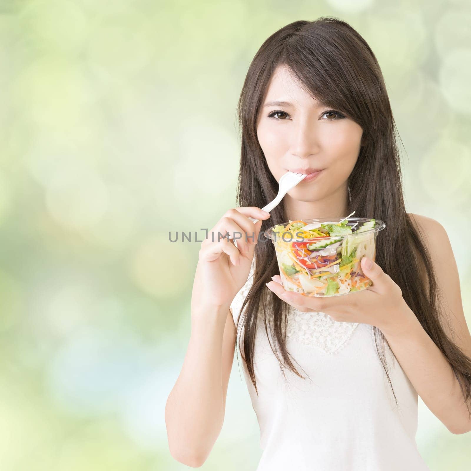 Asian beauty eat salad, closeup portrait.