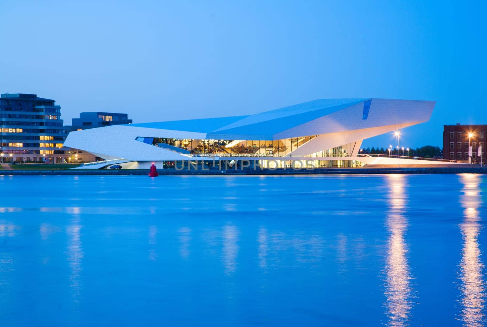 AMSTERDAM - MAY 9  The Eye Film institute Netherlands on the northern bank of the river IJ at sunset on May 9, 2013 in Amsterdam .