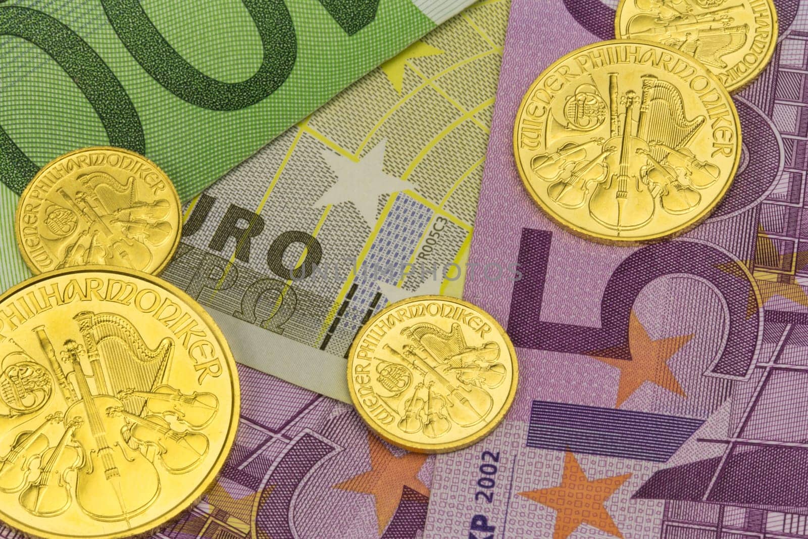 Gold coins from Austria Motif Vienna Philharmonic on euro banknotes
