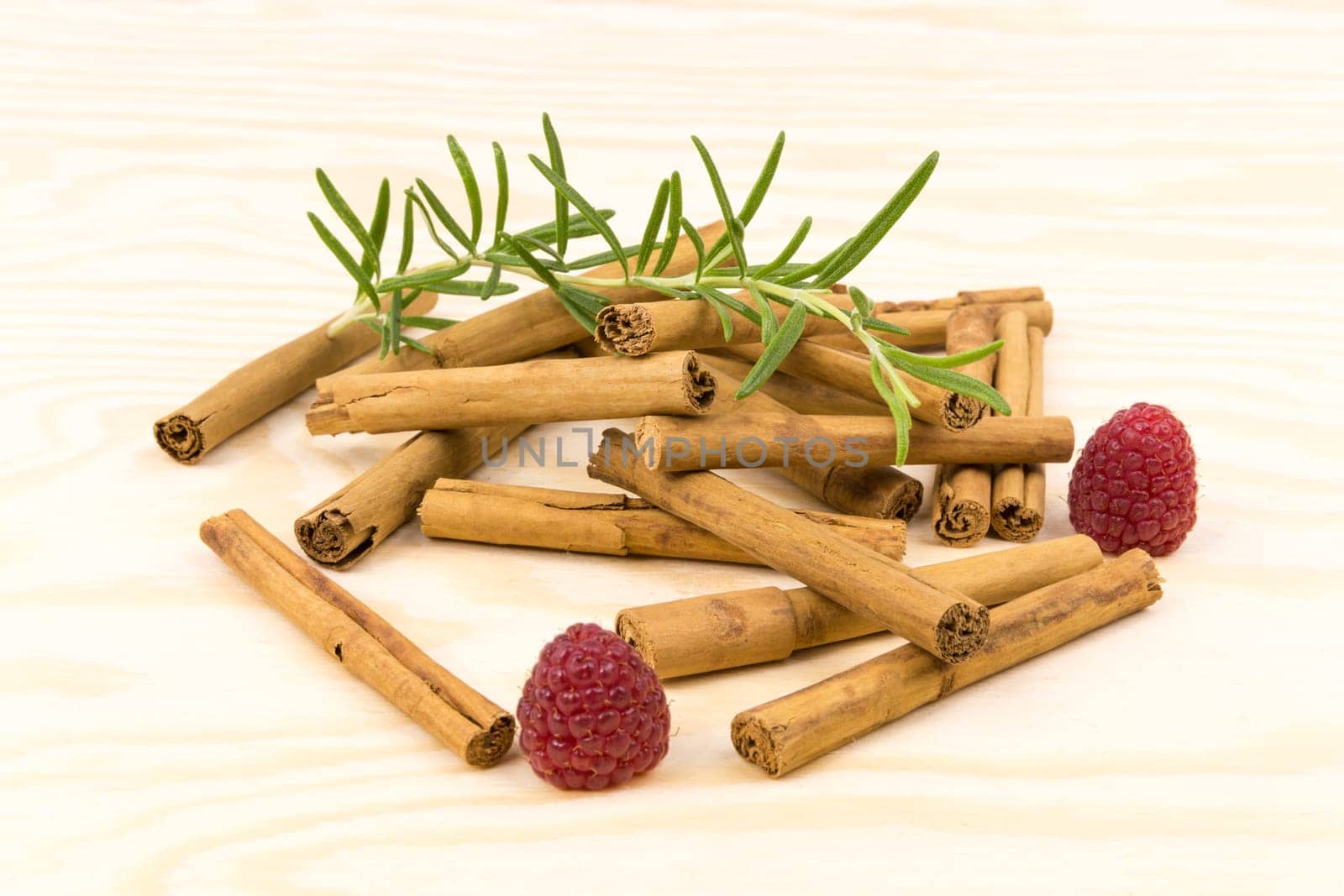 Cinnamon sticks on wooden board