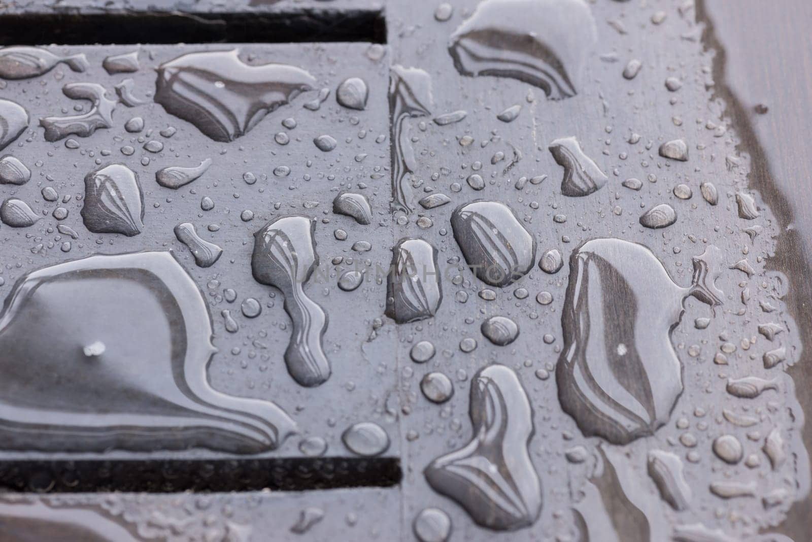 Raindrops on wooden deck