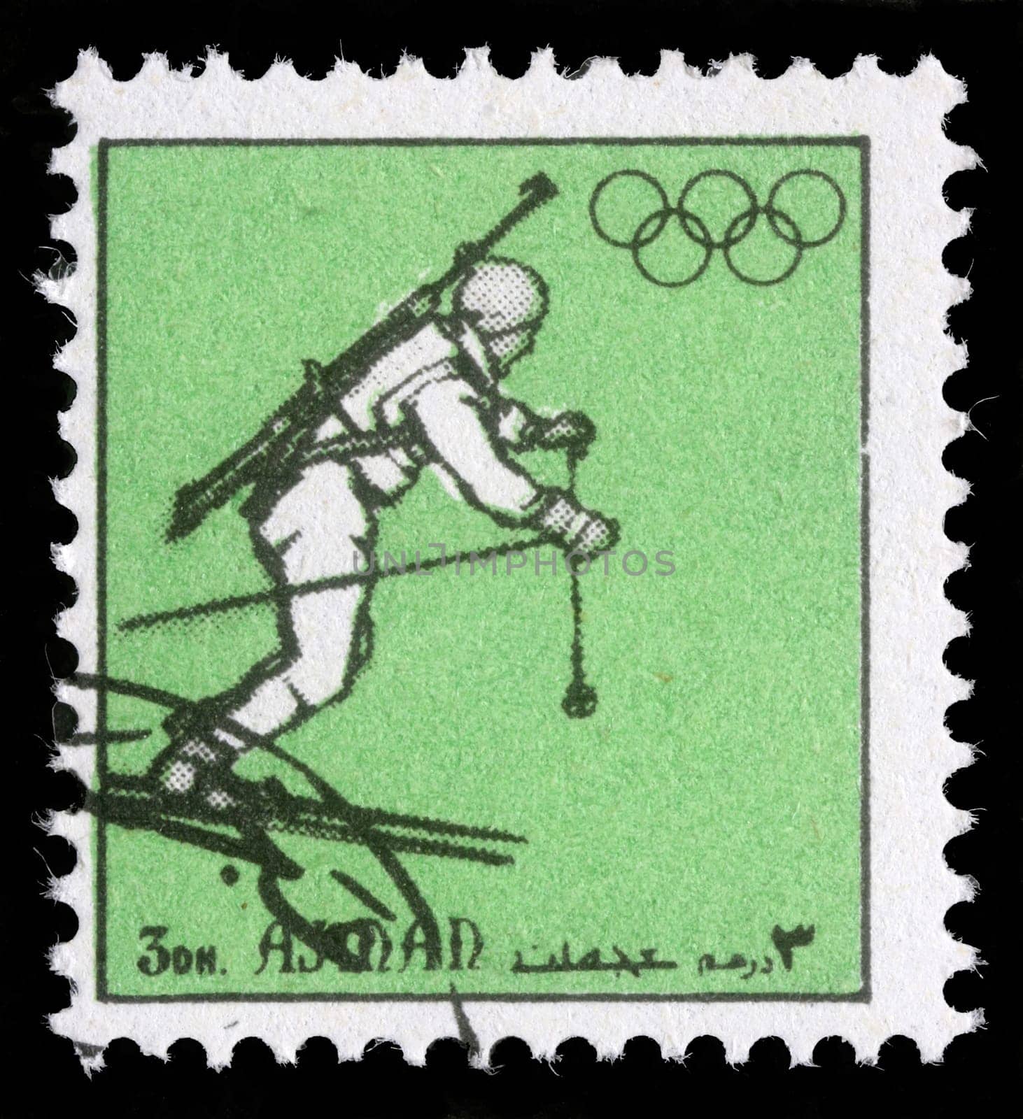 AJMAN - CIRCA 1972: A stamp printed in Ajman shows biathlonist, circa 1972