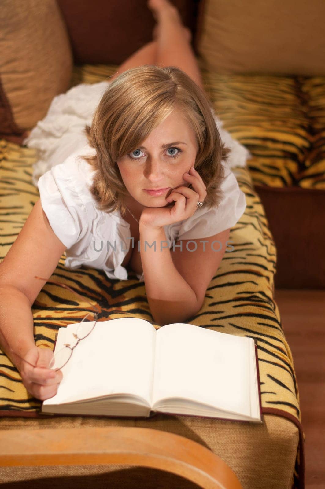 pretty woman with blank book and glasses