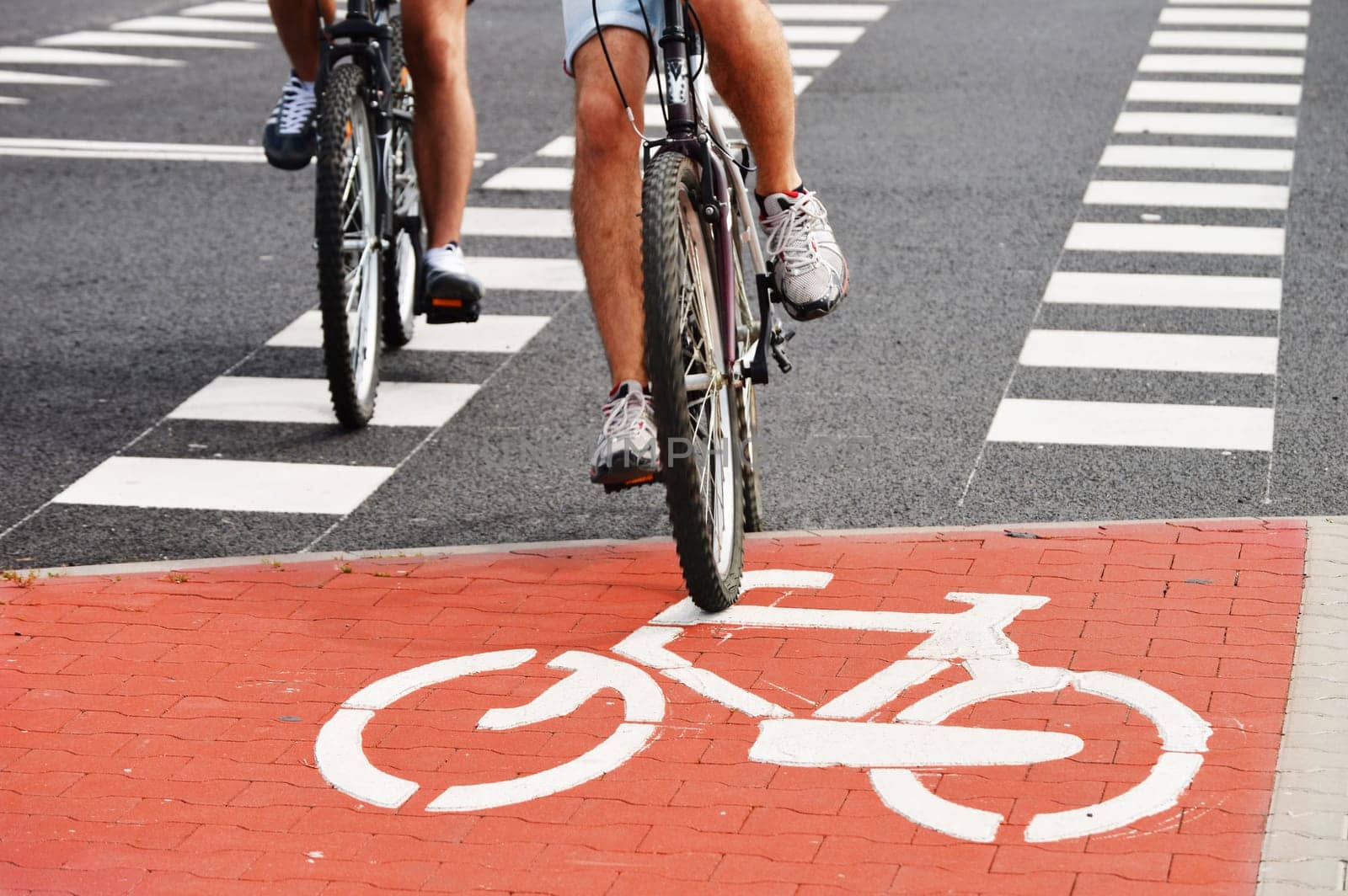 Bicycle road sign and bike riders