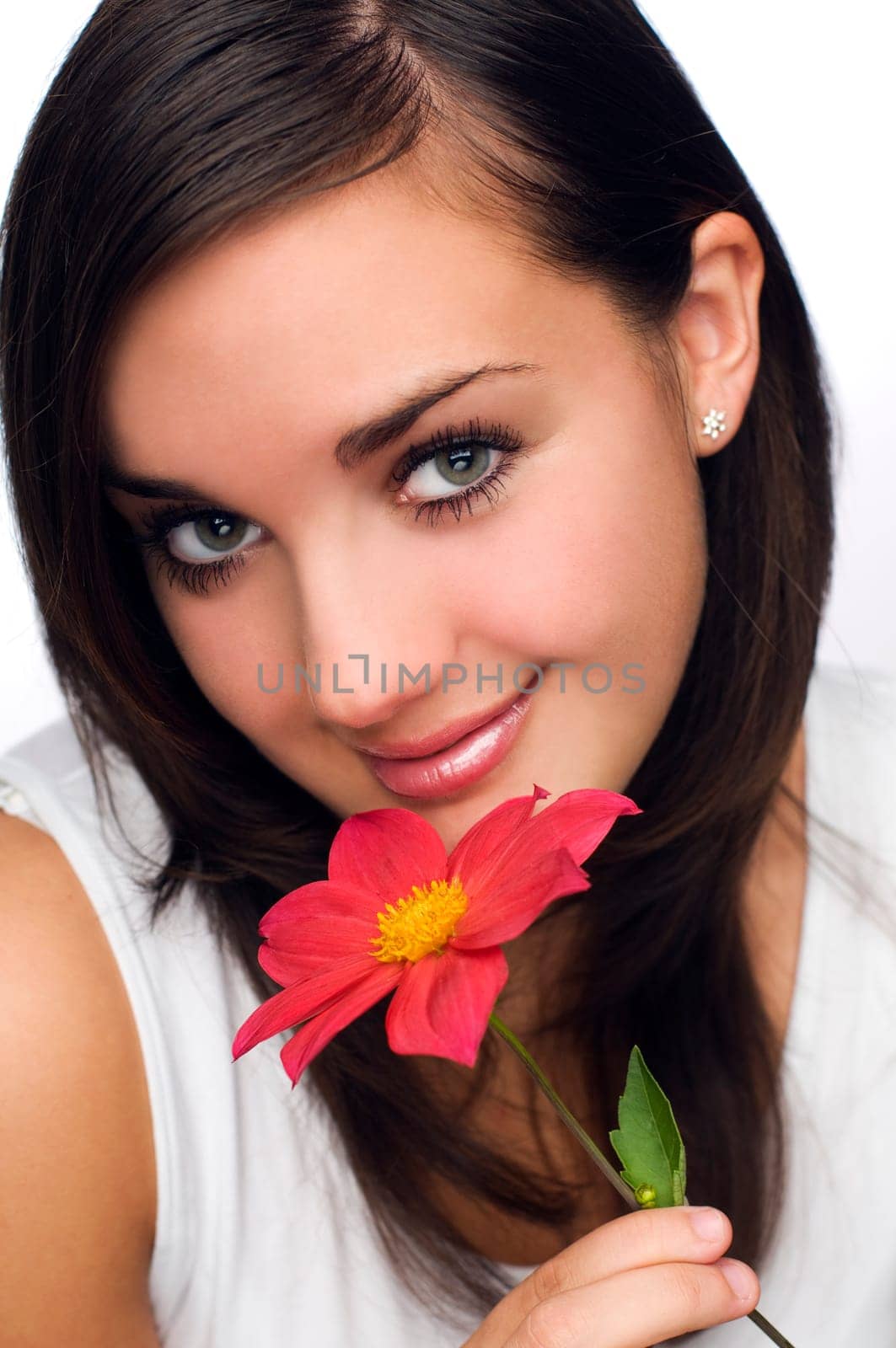 young beautiful brunette with flower close up shoot