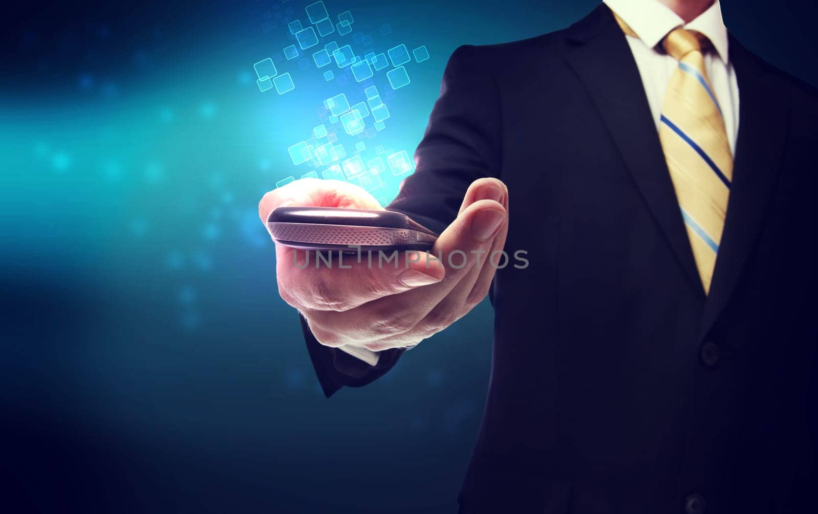 Business man with a mobile phone on a modern technology background